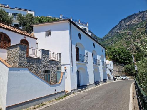 a row of white buildings on a street at HOLIDAY double in Praiano