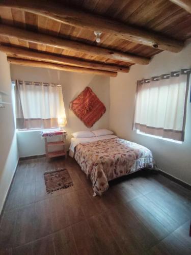 מיטה או מיטות בחדר ב-La casita del valle