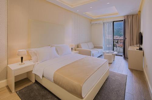 Postel nebo postele na pokoji v ubytování Aparthotel Villa Aria
