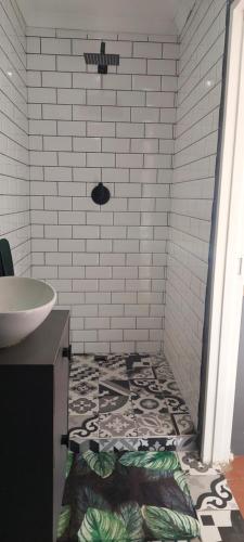 a bathroom with a sink and a tiled floor at Royal Inn Room 2 in Kimberley
