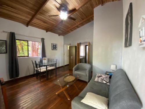 a living room with a couch and a table at CASA NATURaL in Brasilito