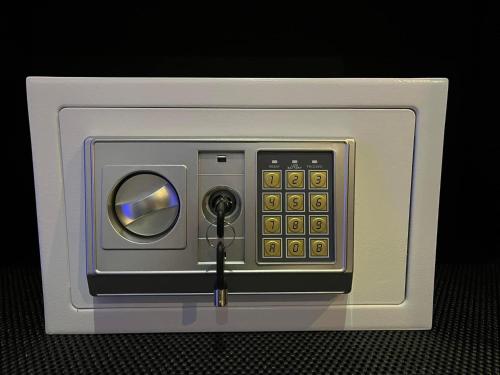 a plastic box with a remote control in it at Sand House in Chaweng