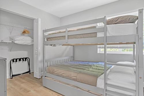 a bedroom with two bunk beds in a room at Sistrunk Shades Villas #5 - Brand New Townhomes in Downtown Fort Lauderdale in Fort Lauderdale
