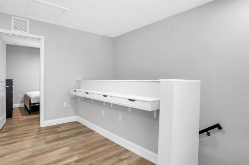 a room with white walls and a white desk at Sistrunk Shades Villas #5 - Brand New Townhomes in Downtown Fort Lauderdale in Fort Lauderdale