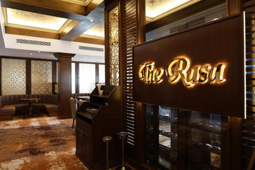 a sign that says the rush in a lobby at Damai Lagoon Resort in Santubong
