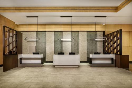 a rendering of a lobby with two desks at The Westin Denver Downtown in Denver