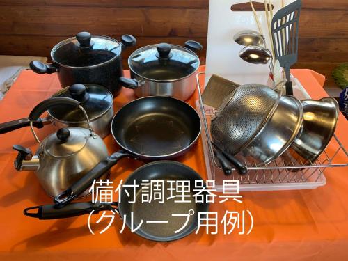 a group of pots and pans on a table at Shurin in Tsumagoi
