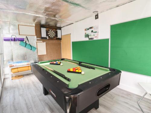 a billiard room with a pool table in it at Beautiful Cotswold View in Bourton on the Water
