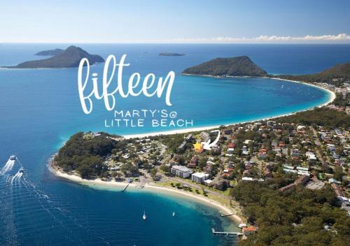 an aerial view of a small island in the ocean at Holiday Paradise - FIFTEEN Marty's @ Little Beach in Nelson Bay