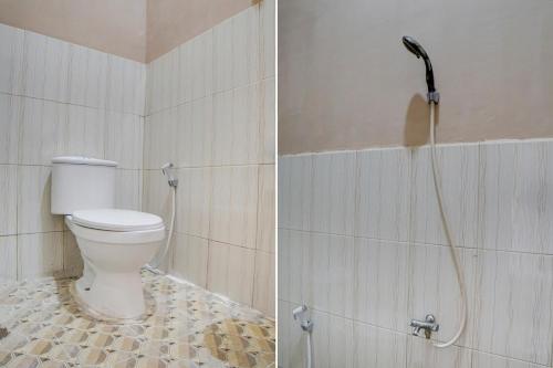 a bathroom with a toilet and a shower at OYO Life 92925 Kost Bu Mala 2 Syariah in Pasuruan