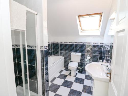 a bathroom with a toilet and a sink at Hazelwood in Leap