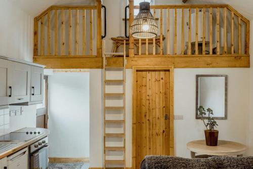 a tree house with a spiral staircase in a kitchen at The Calf House in Borrisoleigh