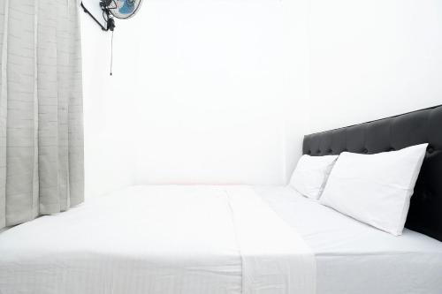 Кровать или кровати в номере OYO Life 1942 Asia Residence Syariah