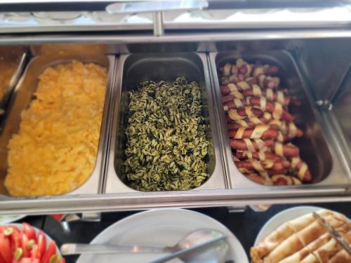 a display case filled with different types of food at Willa Zdrojowa in Polańczyk