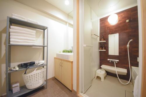 a bathroom with a shower and a sink and a toilet at Comfy Stay TDS in Nara