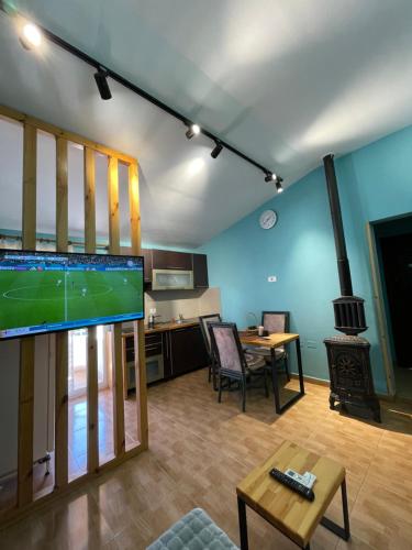 a living room with a flat screen tv and a fireplace at House for rent Jurgen in Golem