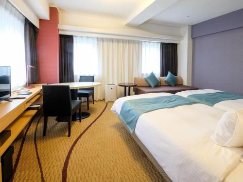 Postel nebo postele na pokoji v ubytování Hotel Buena Vista