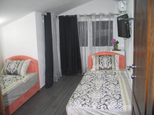 Postel nebo postele na pokoji v ubytování Guest House Dena