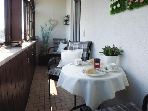 a table with a plate of food on it at Apartment Schlossblick - Top location in Idar-Oberstein