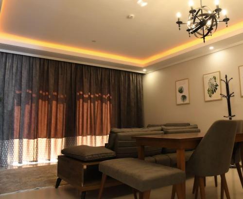 a living room with a couch and a table at YM Resort in Yanbu