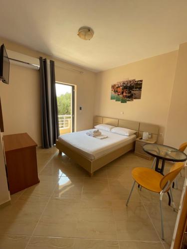 Ένα ή περισσότερα κρεβάτια σε δωμάτιο στο Belvedere Hotel & Suites