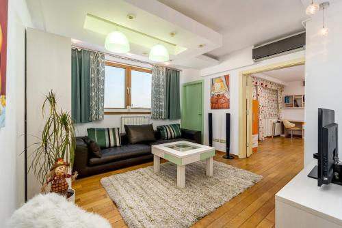 a living room with a couch and a table at Apartment Botero in Belgrade