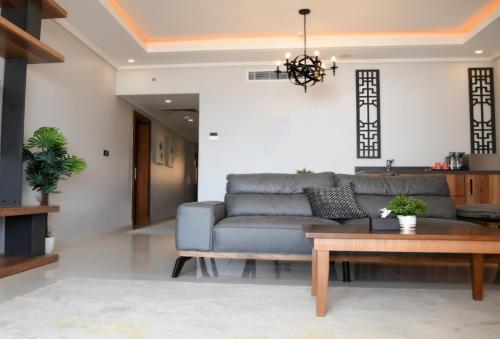 a living room with a couch and a table at YM Resort in Yanbu