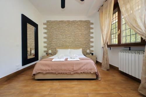 a bedroom with a bed with two white towels on it at Vatican Flat Cozy with Private Court in Rome