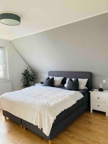a bedroom with a large bed in a room at Pool, Sauna und Blick ins Grüne in Lutherstadt Wittenberg