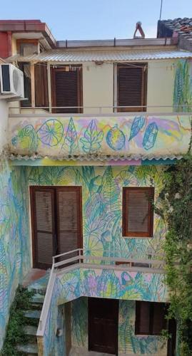 a building with a painting on the side of it at B&B Il Vicoletto - Vitulazio in Vitulazio