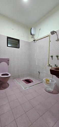 a bathroom being remodeled with a toilet and a sink at HOMESTAY - AC 3 BHK NEAR AlRPORT in Chennai