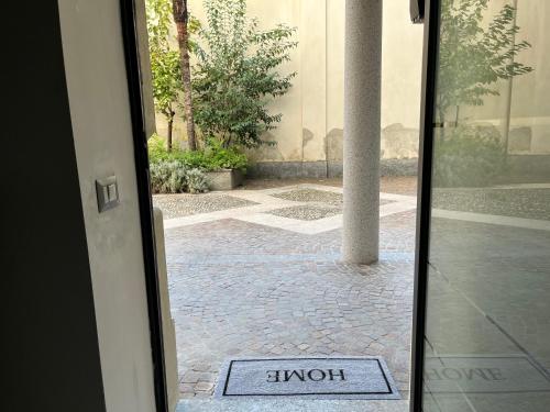 a door with a sign that says hy hospital on it at Loft Matteotti - Studio in centro in Busto Arsizio