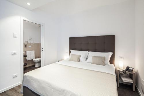 Posteľ alebo postele v izbe v ubytovaní Hotel Studio Inn Centrale & Milano Urban Padel
