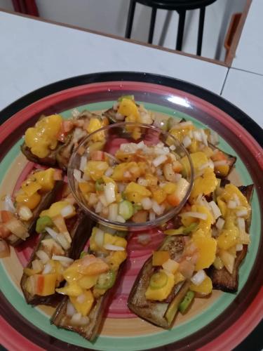 a plate with a plate of food on a table at Riverside at Aninuan Accommodation and Food in Puerto Galera