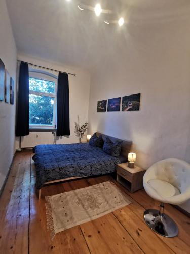 a bedroom with a bed and a tub and a sink at Ferienwohnung Auf dem Georgenberg in Naumburg