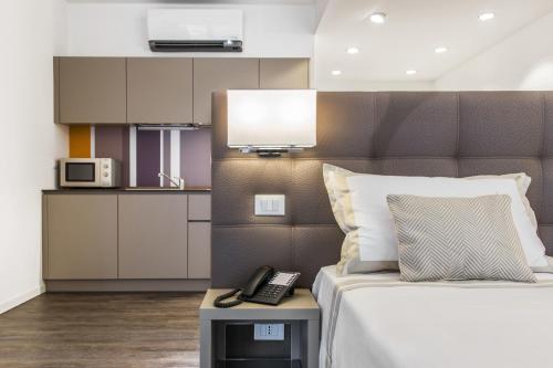 Kuchyňa alebo kuchynka v ubytovaní Hotel Studio Inn Centrale & Milano Urban Padel