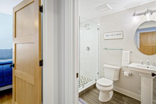 a bathroom with a toilet and a sink at Harborwalk Lower and Upper in Camden