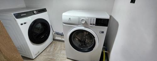a washing machine and a dryer in a room at Tatents Toon Guesthouse in Gyumri