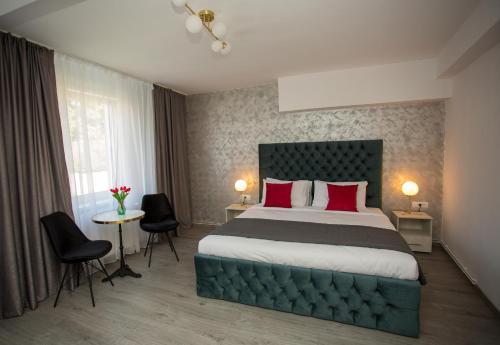 En eller flere senge i et værelse på VSA Boutique House