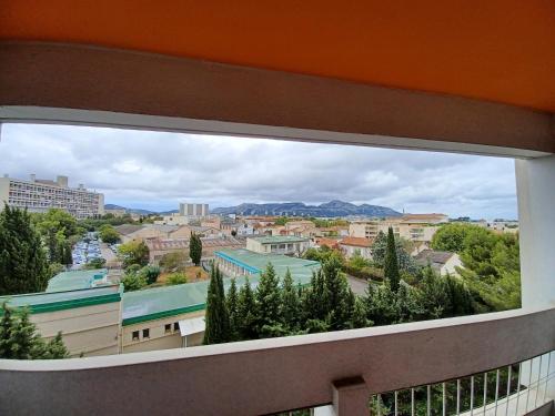 a view of a city from a window at chambre double proche stade VELODROME in Marseille