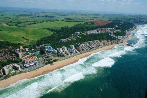 an aerial view of a beach and the ocean at Umdloti Holiday Resort Apartment 514 - Amazing Breaker & Ocean Views in Umdloti