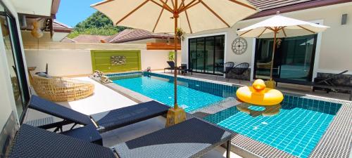 an indoor swimming pool with an inflatable at Sila Thai Pool Villa2 in Ao Nang Beach