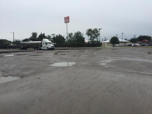 a semi truck parked in a parking lot at Texas Inn and Suites City Center at University Dr. in Edinburg