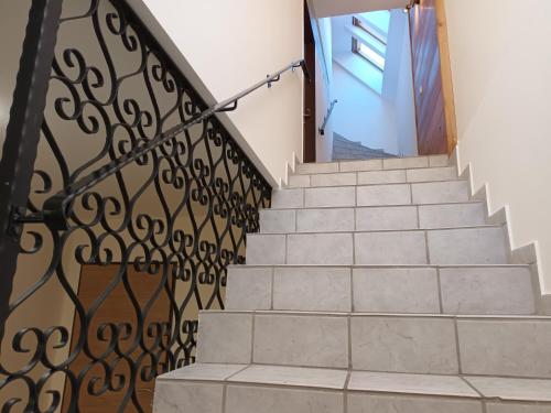 a set of stairs with a wrought iron railing at In der Wachau in Weissenkirchen in der Wachau