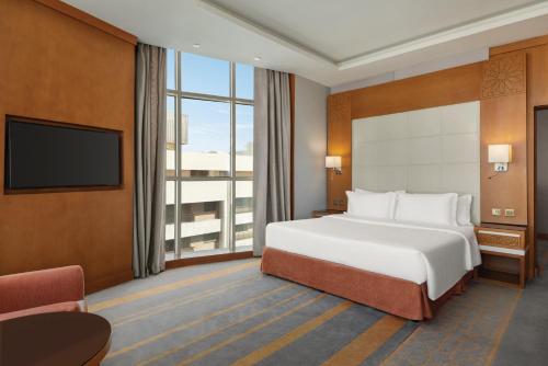 Ένα ή περισσότερα κρεβάτια σε δωμάτιο στο Vivid Jeddah Hotel, a member of Radisson Individuals