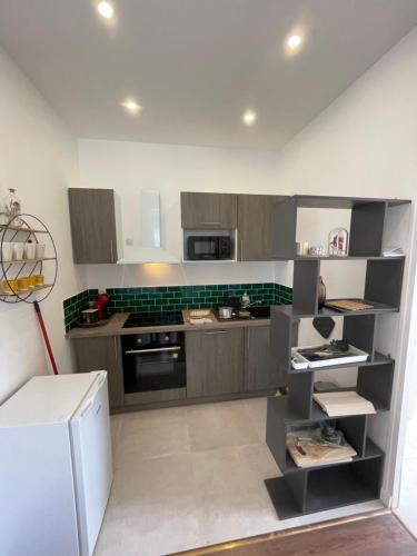 Dapur atau dapur kecil di L'Herboriste - Appartements meublés