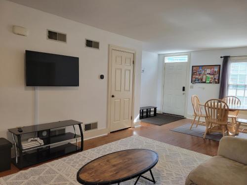 a living room with a couch and a table at The Grand BnB in Harrisburg