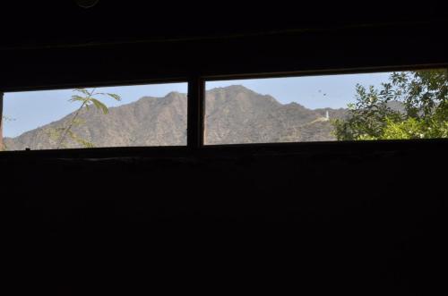 a window with a view of a mountain at Casamora in Belén