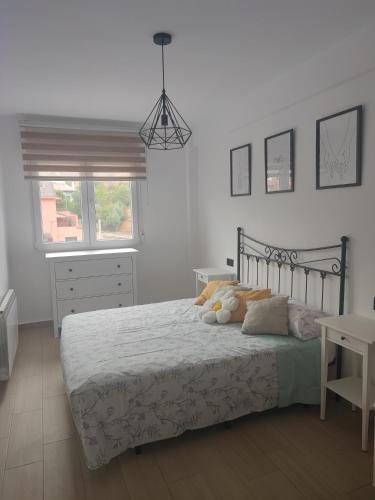 Ένα ή περισσότερα κρεβάτια σε δωμάτιο στο Apartamento Buen Recuerdo