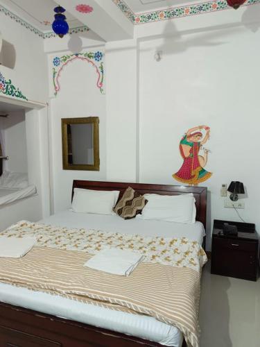 a bedroom with a large bed in a room at The Royal Lake View Villa in Udaipur